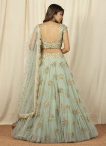 Mint green net lehenga with sequins embroidery wedding wear back view