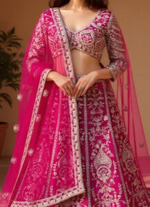 Pink festive net umbrella-cut lehenga choli with embroidered dupatta closeup view